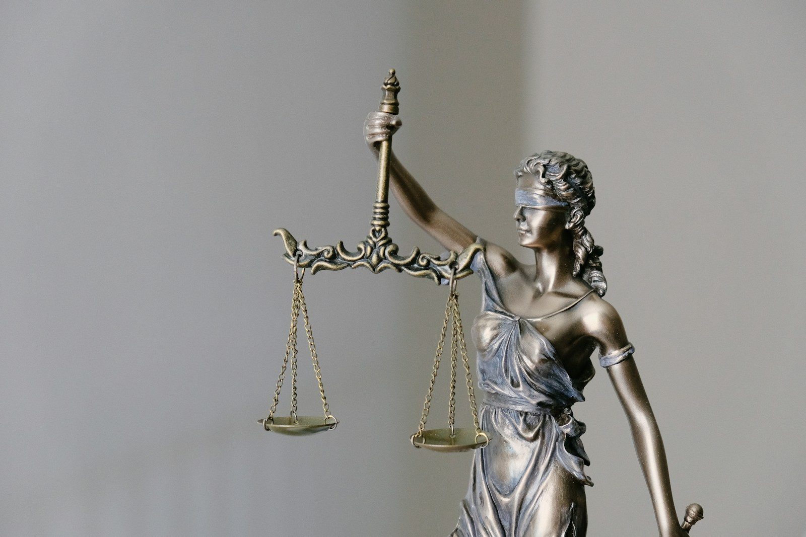 lady justice statue with scales and sword